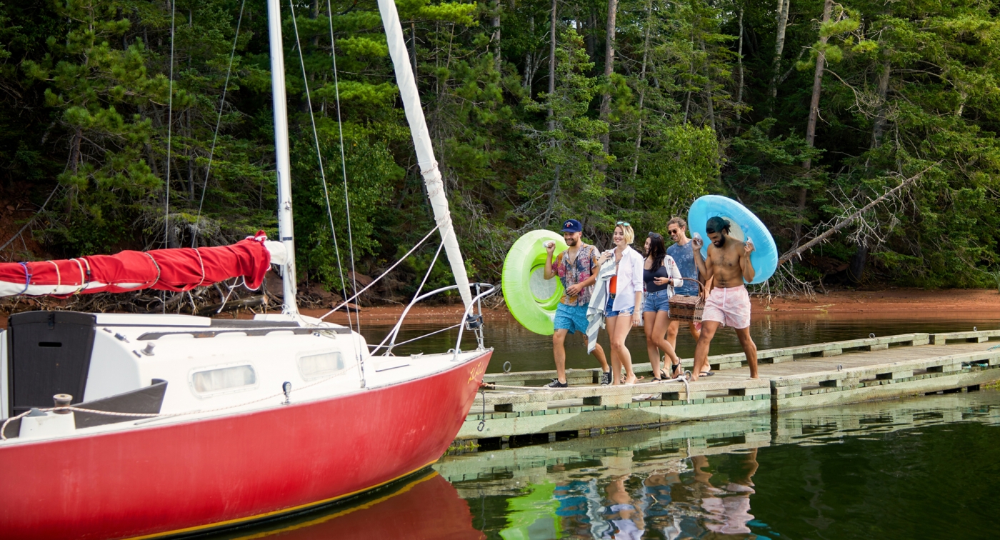 Boat, group of people, docks, inner-tubes