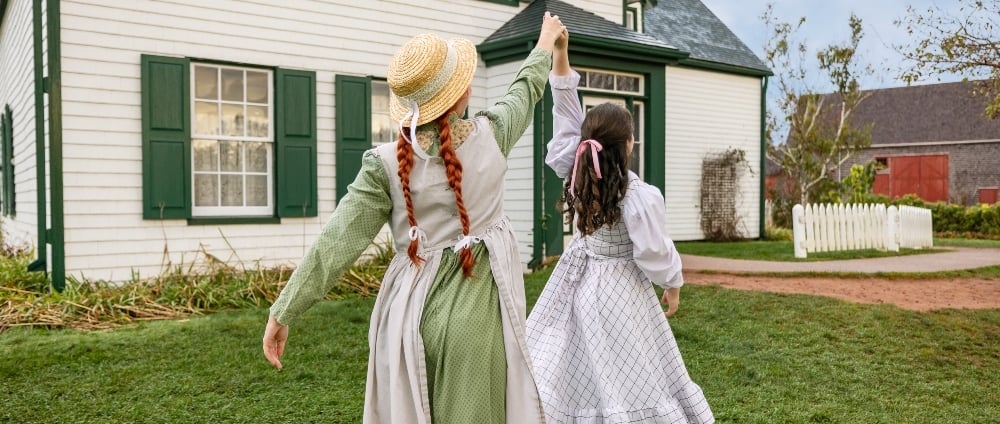 Green Gables Heritage Place, Cavendish Anne and Diana play on front lawn of Green Gables Heritage Place