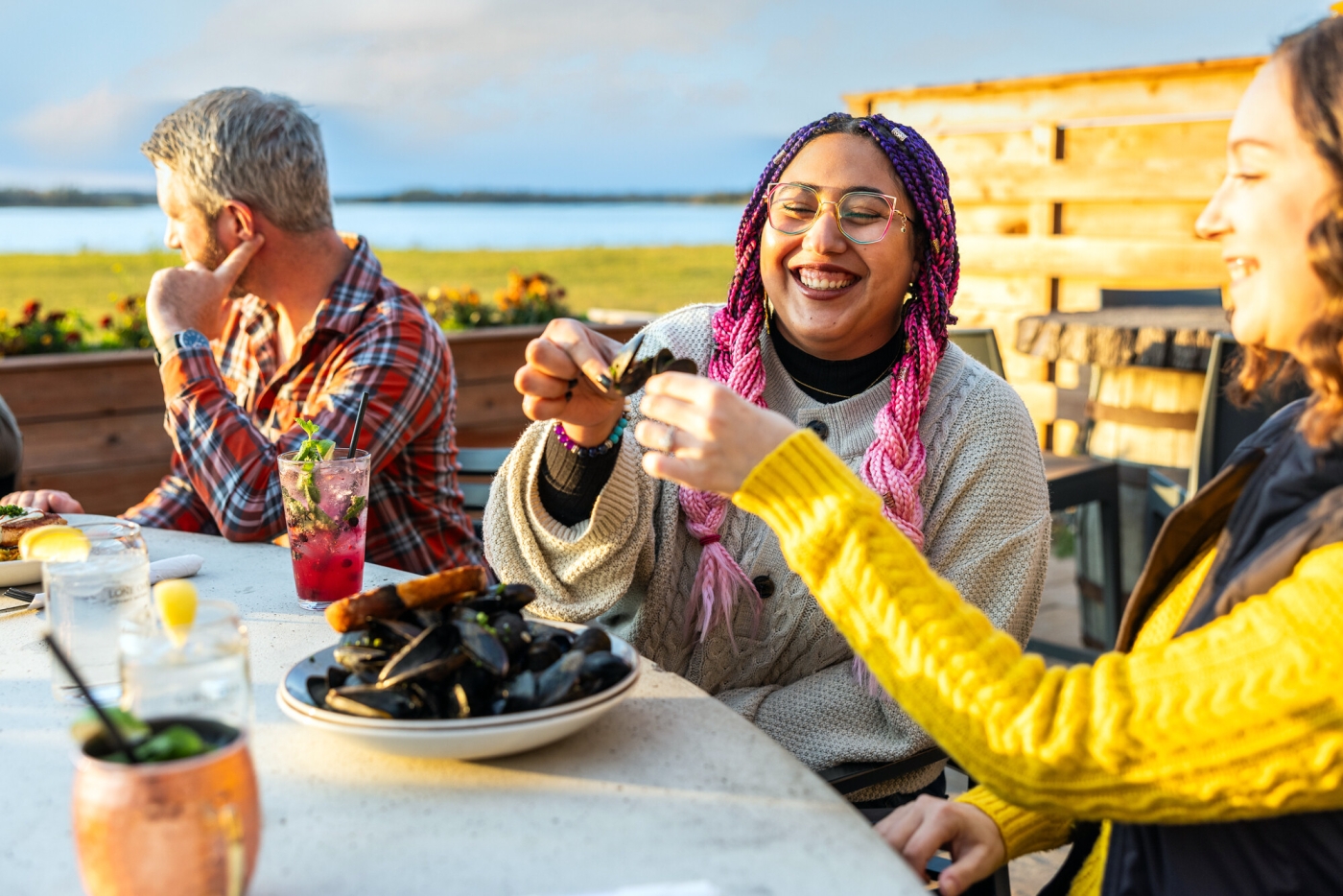 Lone Oak Brew Pub, PEI Group of three share mussels on patio at Lone Oak Brew Pub