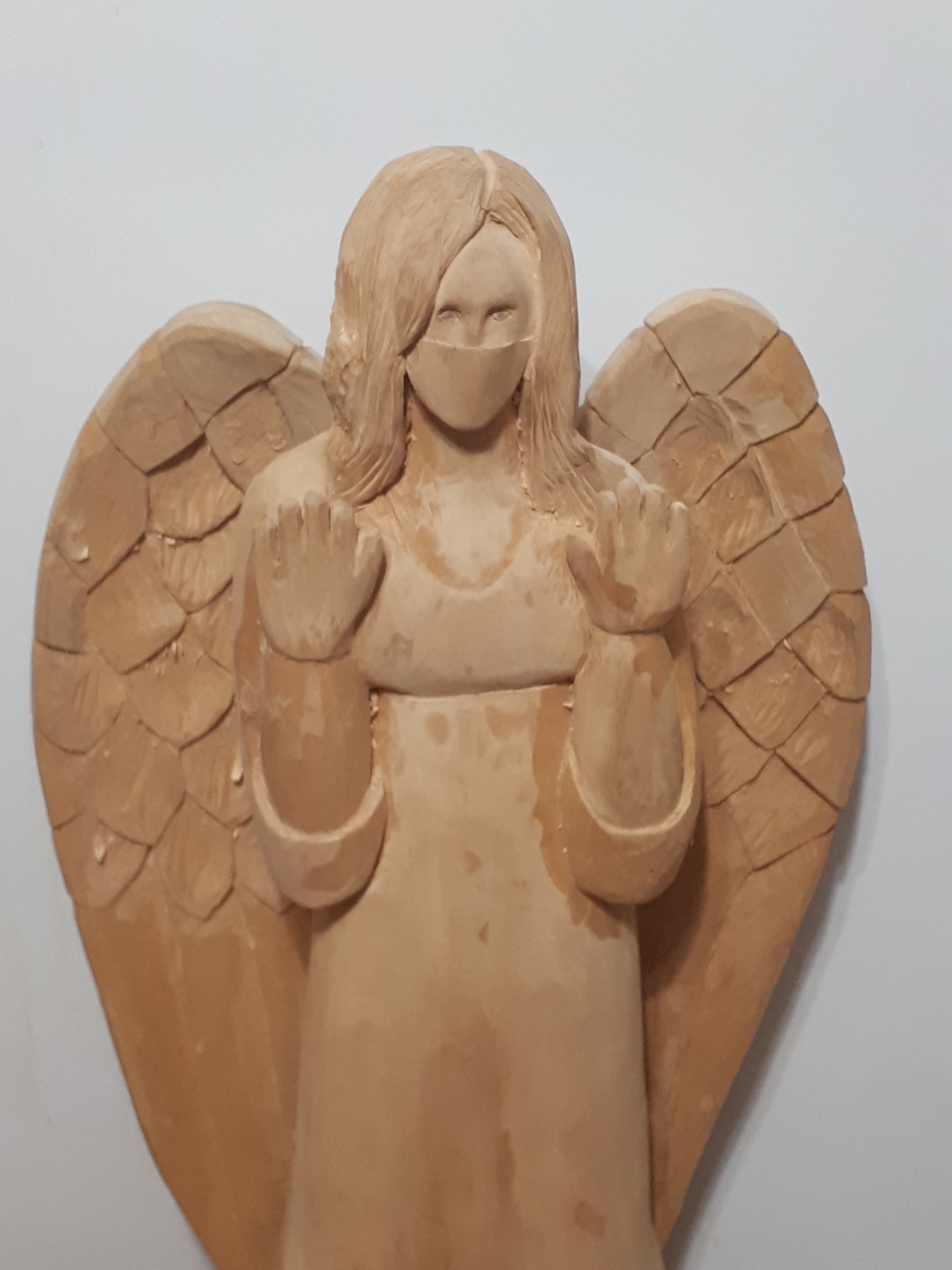 Wood carving of Dr. Heather Morrison