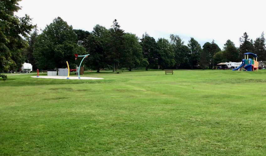 Large green space, splash pad and playground