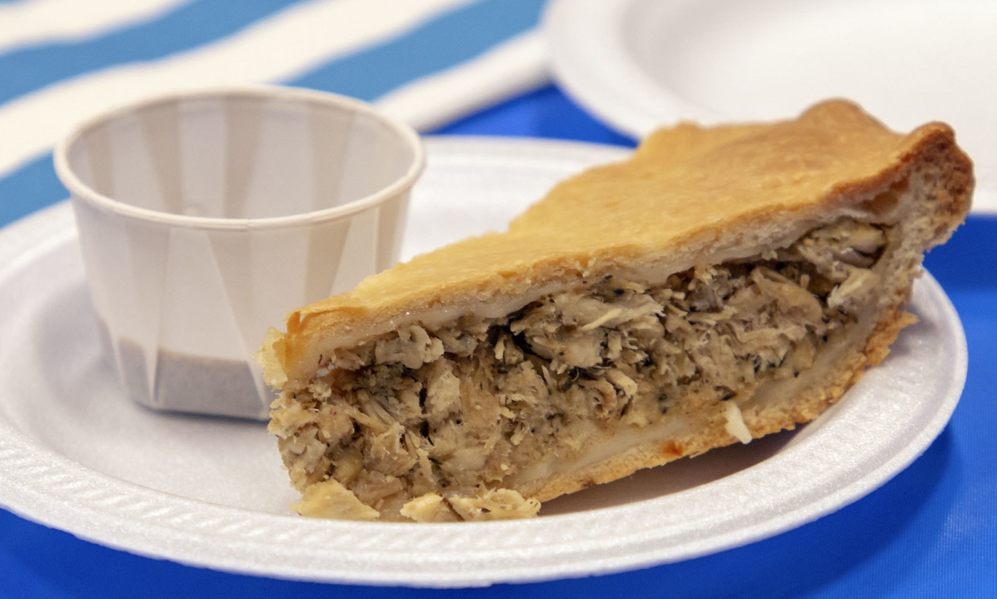 Paper plate on table with Acadian Meat Pie