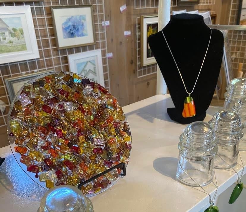 Selection of PEI-made items including glasswork and watercolour art at Artisans Waterfront Montague