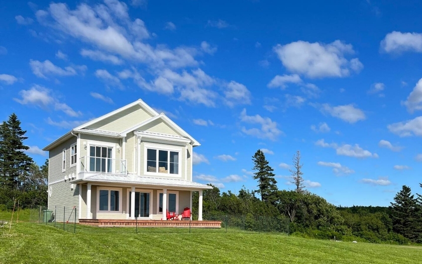 Large two-storey property overlooking a large front yard on a hill