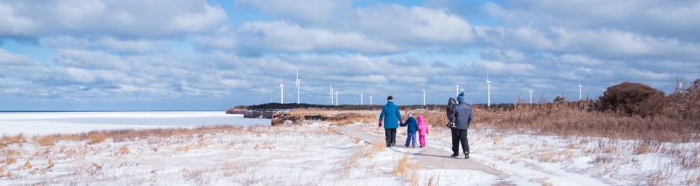 Family walking on Black Marsh Trail near North Cape, PEI