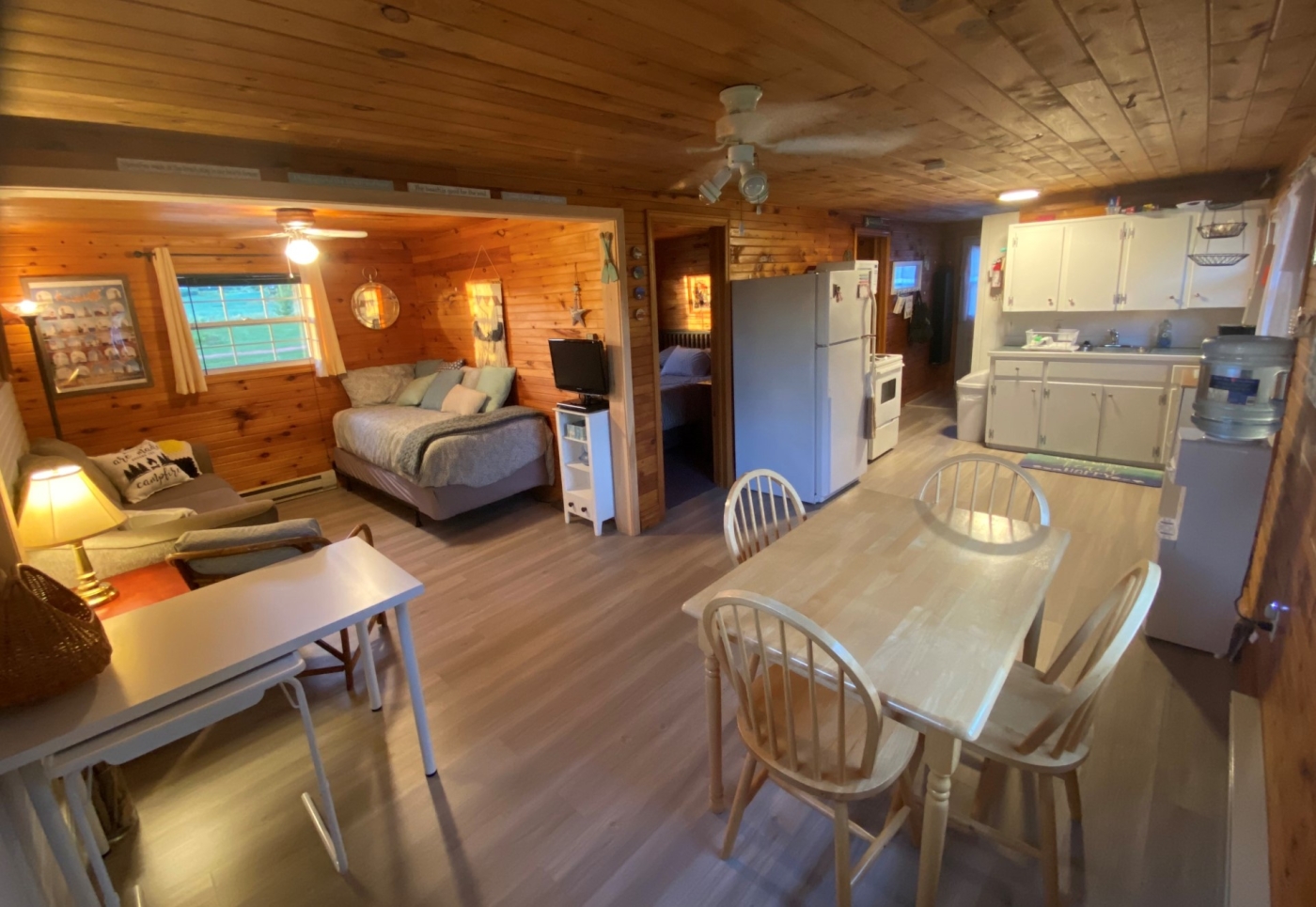 Cozy nook photo of inside of cottage, with couch dining table etc