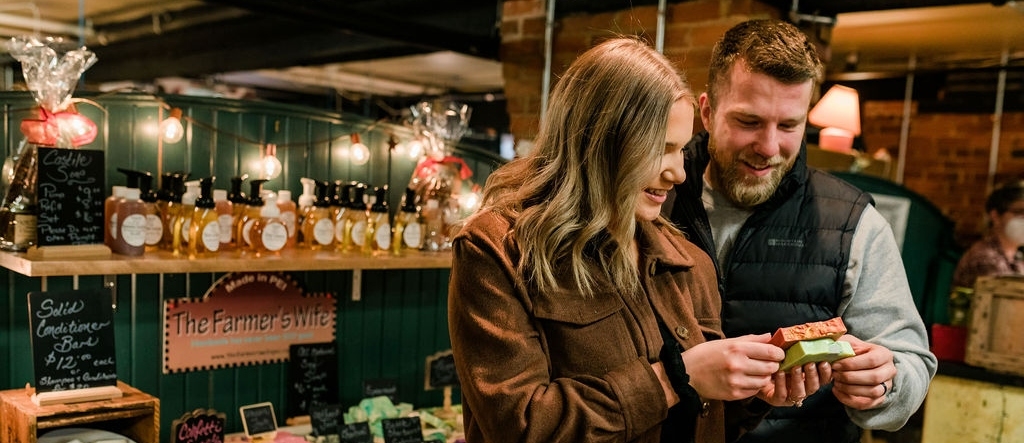 Couple look at soap at Summerside Farmers' Market