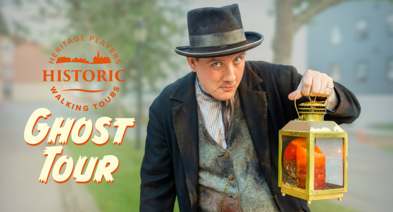 Historic Heritage Players Heritage actor hold lantern with graphic text "Historic Heritage Players Walking Ghost Tour"