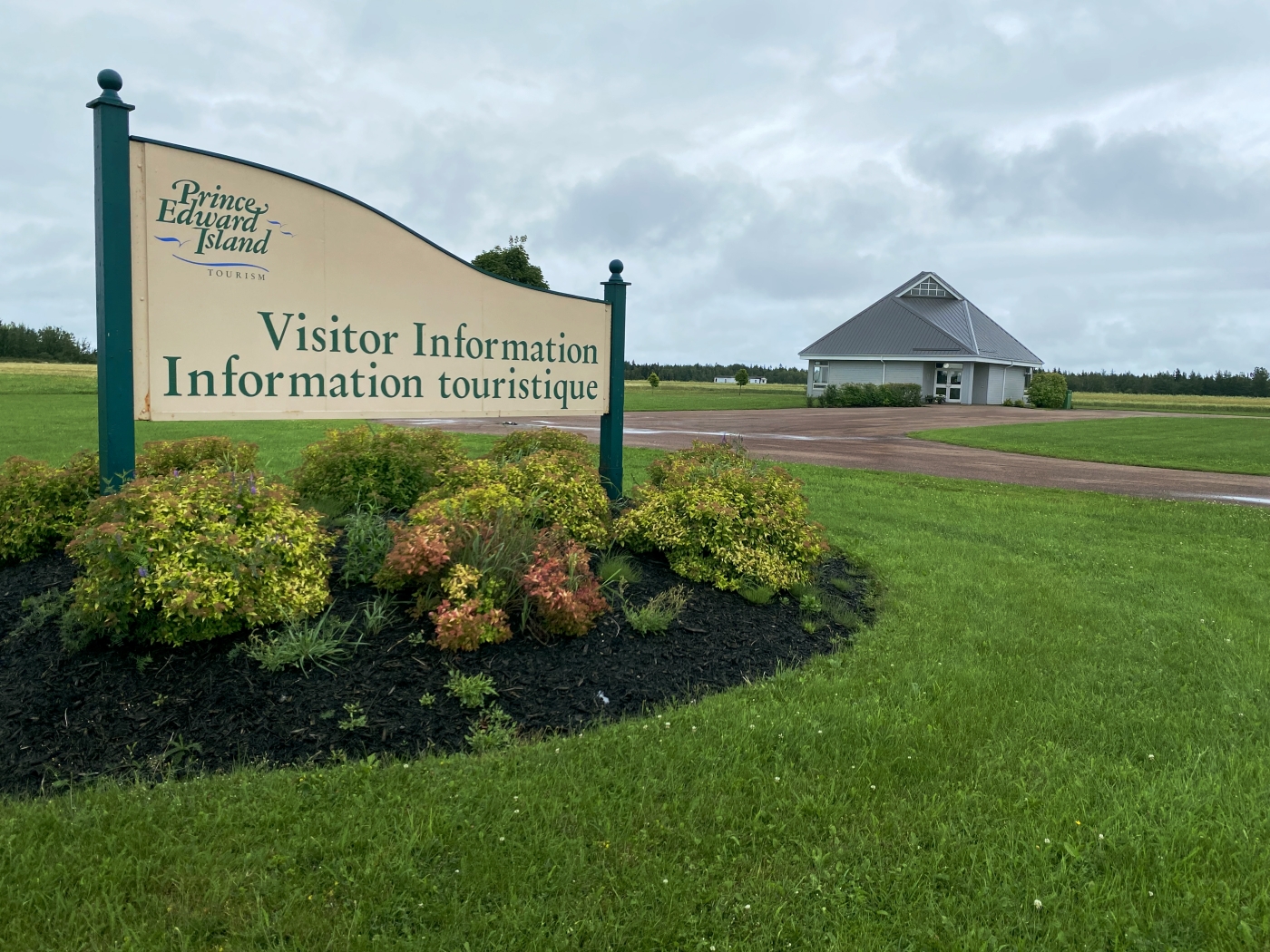 Exterior view of West Prince Visitor Information Centre with sign in foreground and building in background