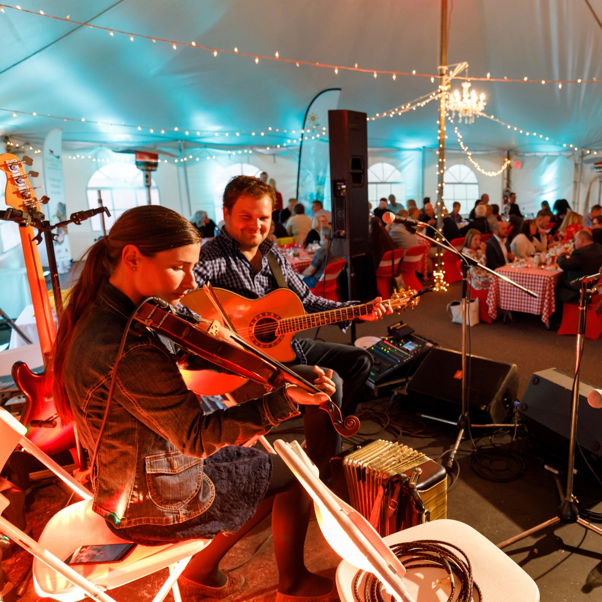 Live Music, PEI Duo plays music on stage under tent at PEI Shellfish Festival