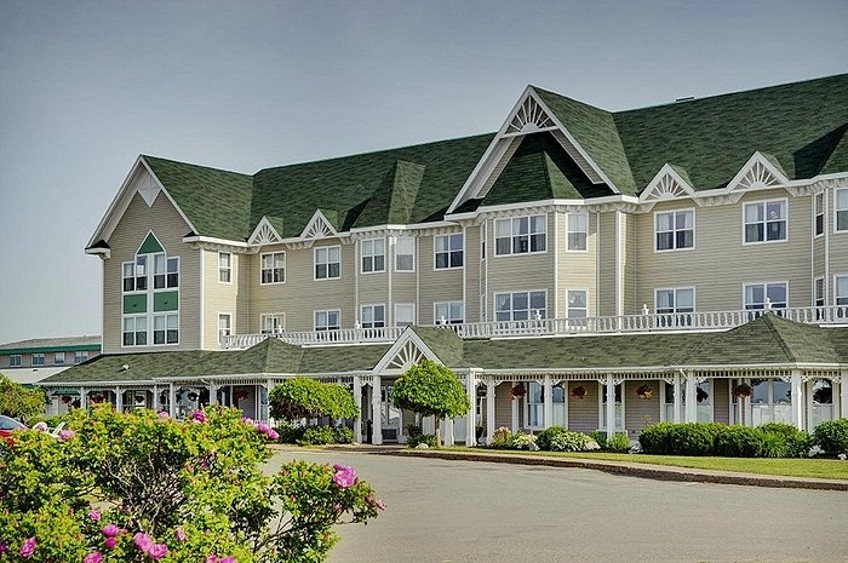 Outside image of the Loyalist Country Inn, beige building with full verandah