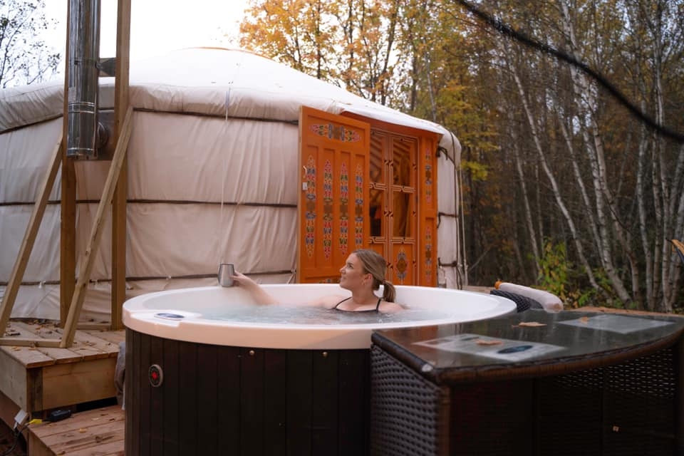 Nature Space Eco Resort, Prince Edward Island Female in hot tub with tub in background at Nature Space Eco Resort