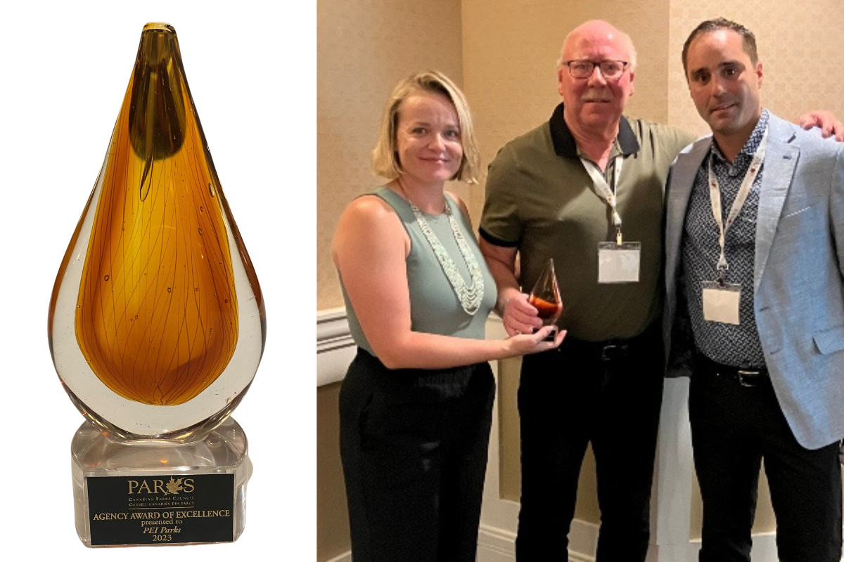 Image of Award of Excellence tropy and group image with presenter, Kevin MacLaren and Brodie O'Keefe of Tourism PEI accepting the award