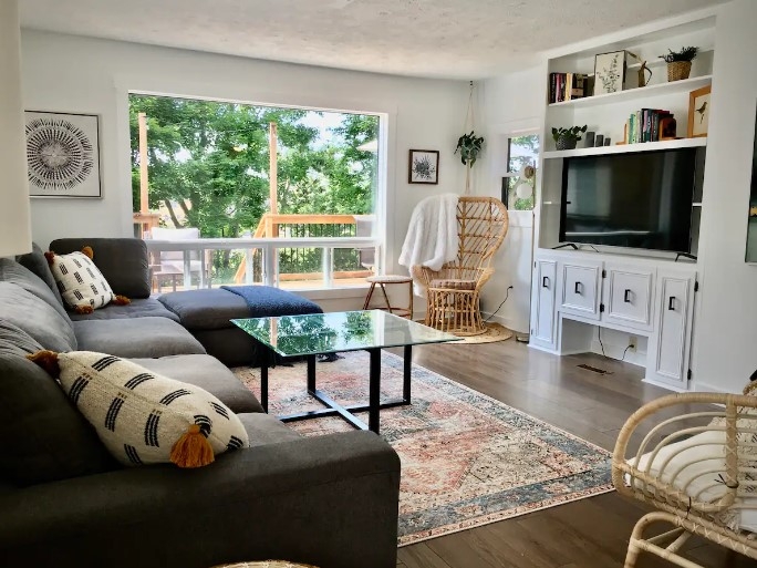 Parkman photo of living room with large couch TV and chairs
