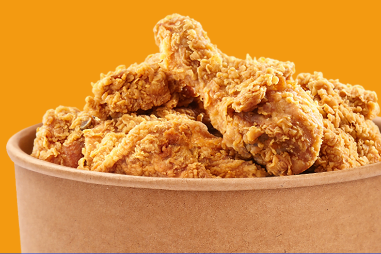 Image of bucket of fried chicken with yellow background