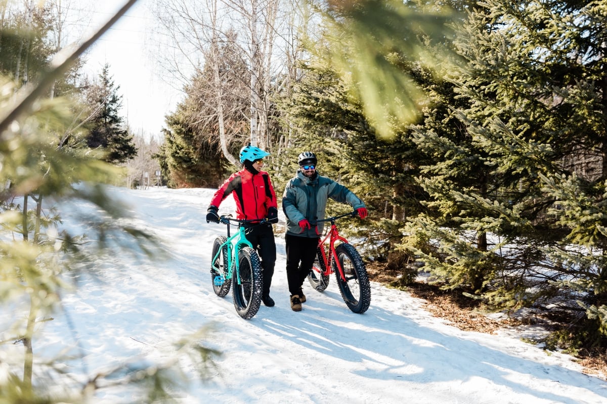 Couple on winter fat bikes in Rotary Friendship Park, Summerside