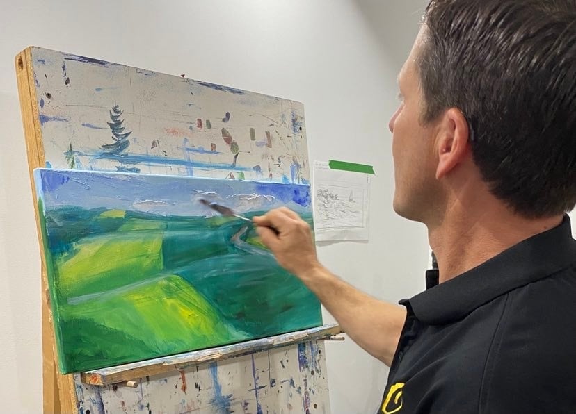 Scott O'Neil paints a PEI landscape in his studio