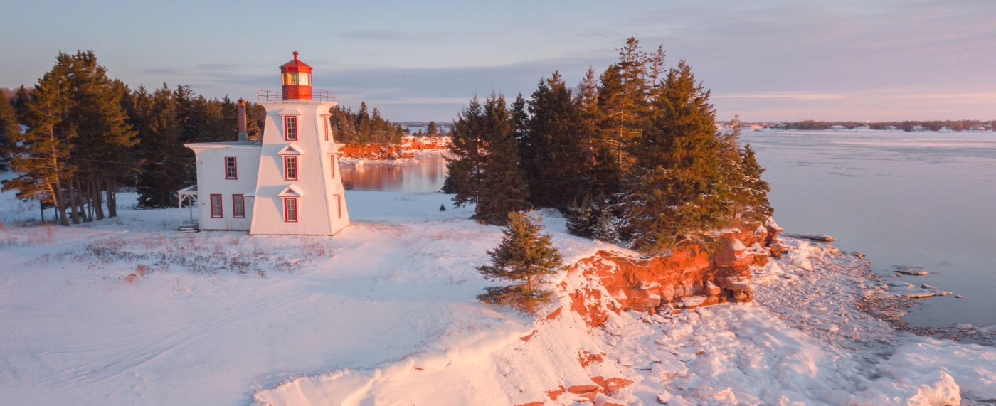 Aerial view of Block Lighthouse and red cliffs in winter