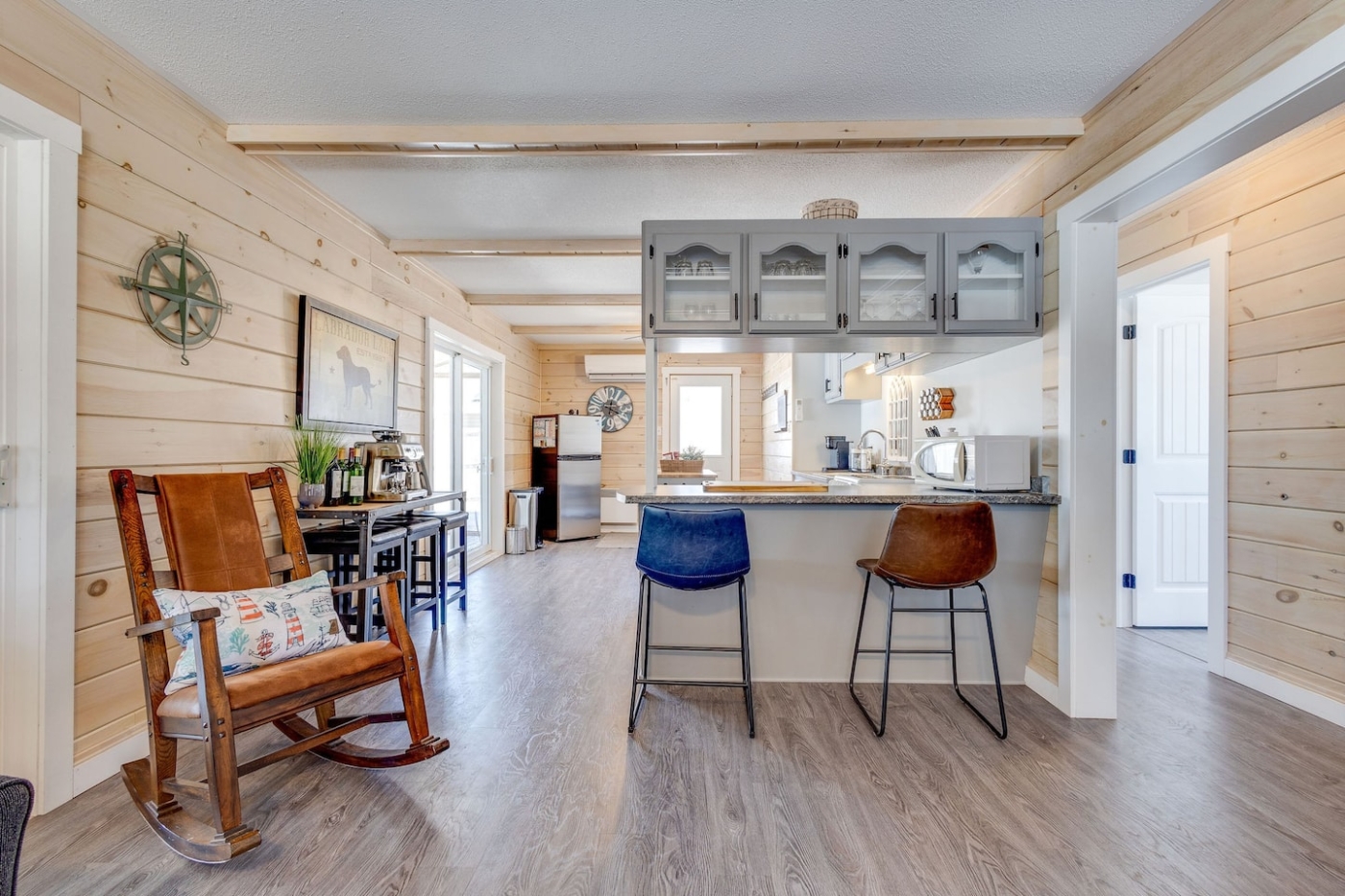 Kitchen area with island and bar stools