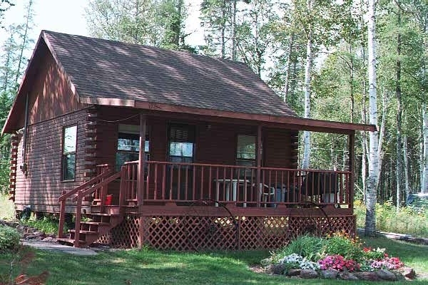 Brudenell River cottage outside view of a log cabin with front porch