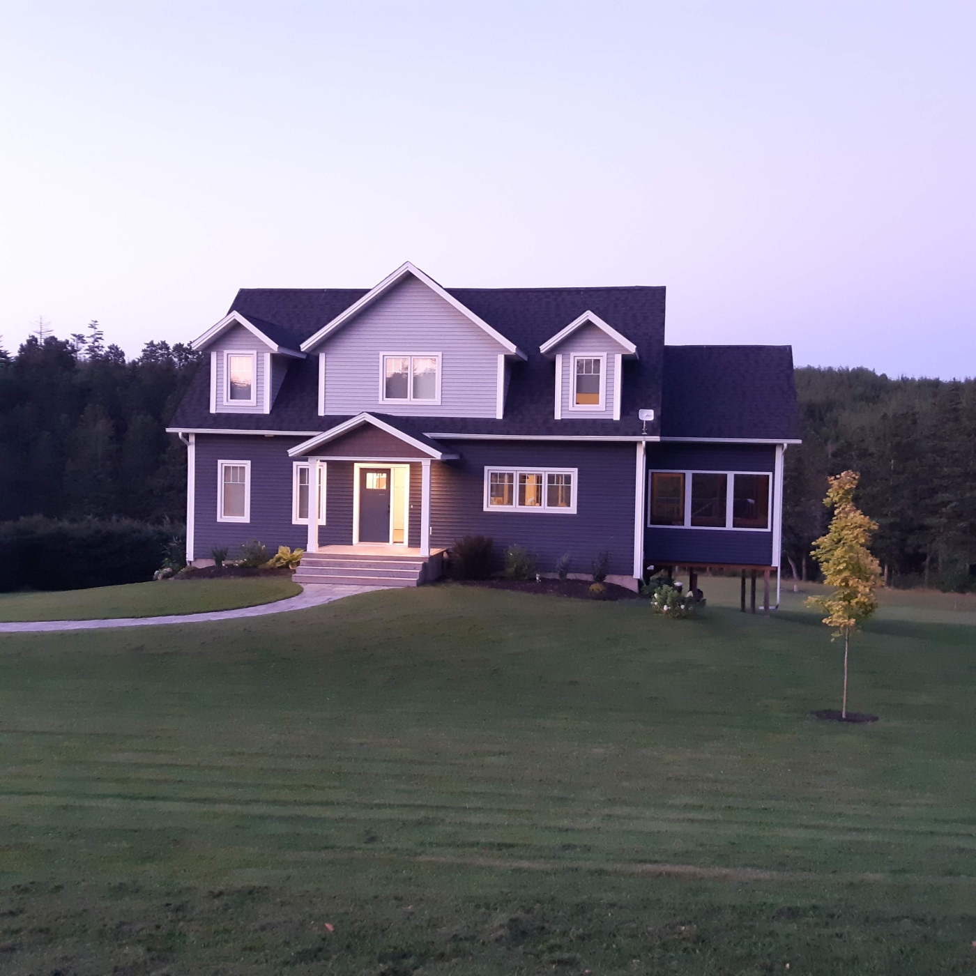 Heron Hollow outside view looking at a cape cod style home.