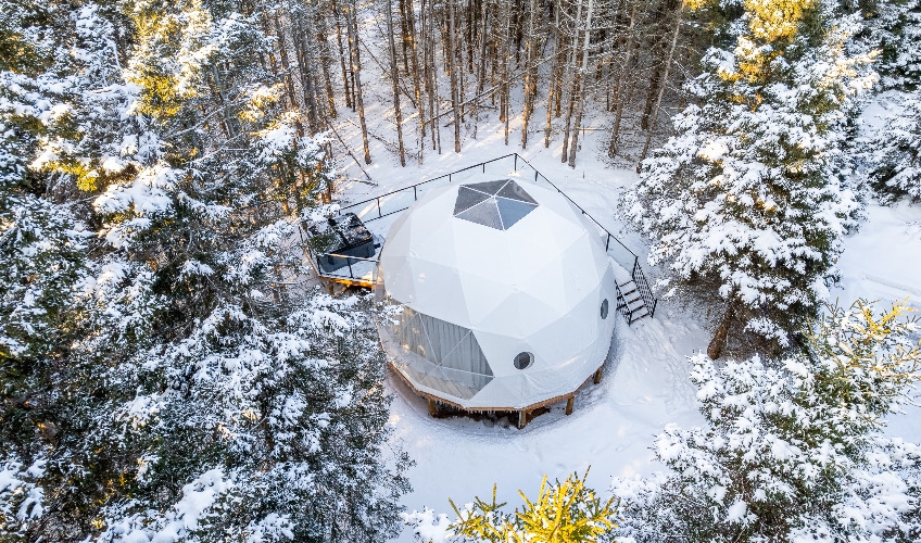 Aerial view of Maytree Eco-Retreat dome in winter