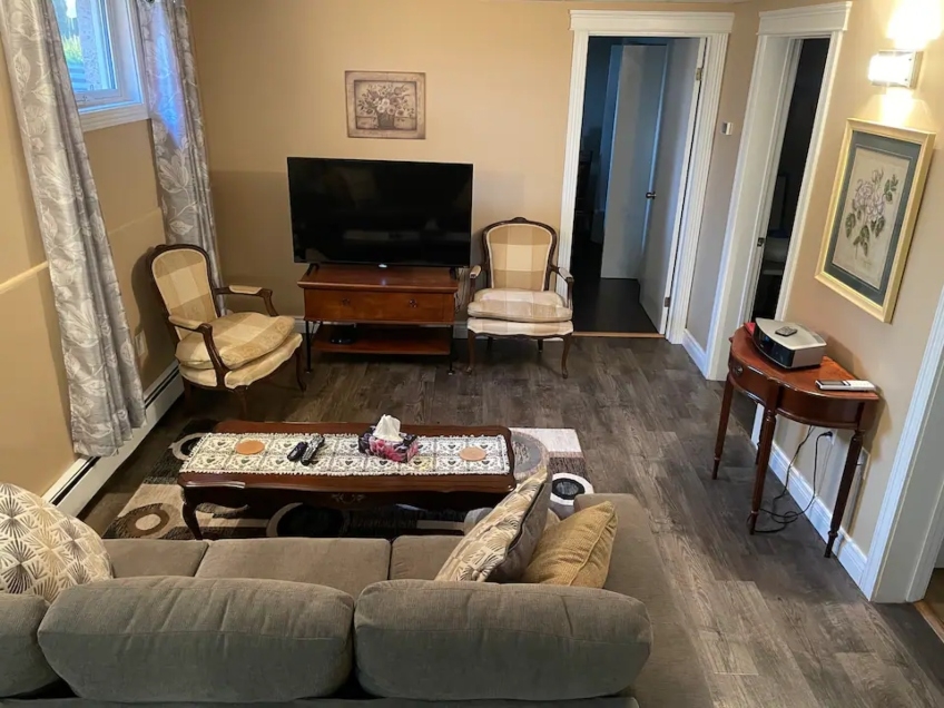 PJ's picture of Livingroom, two armchairs, couch, coffee table and TV