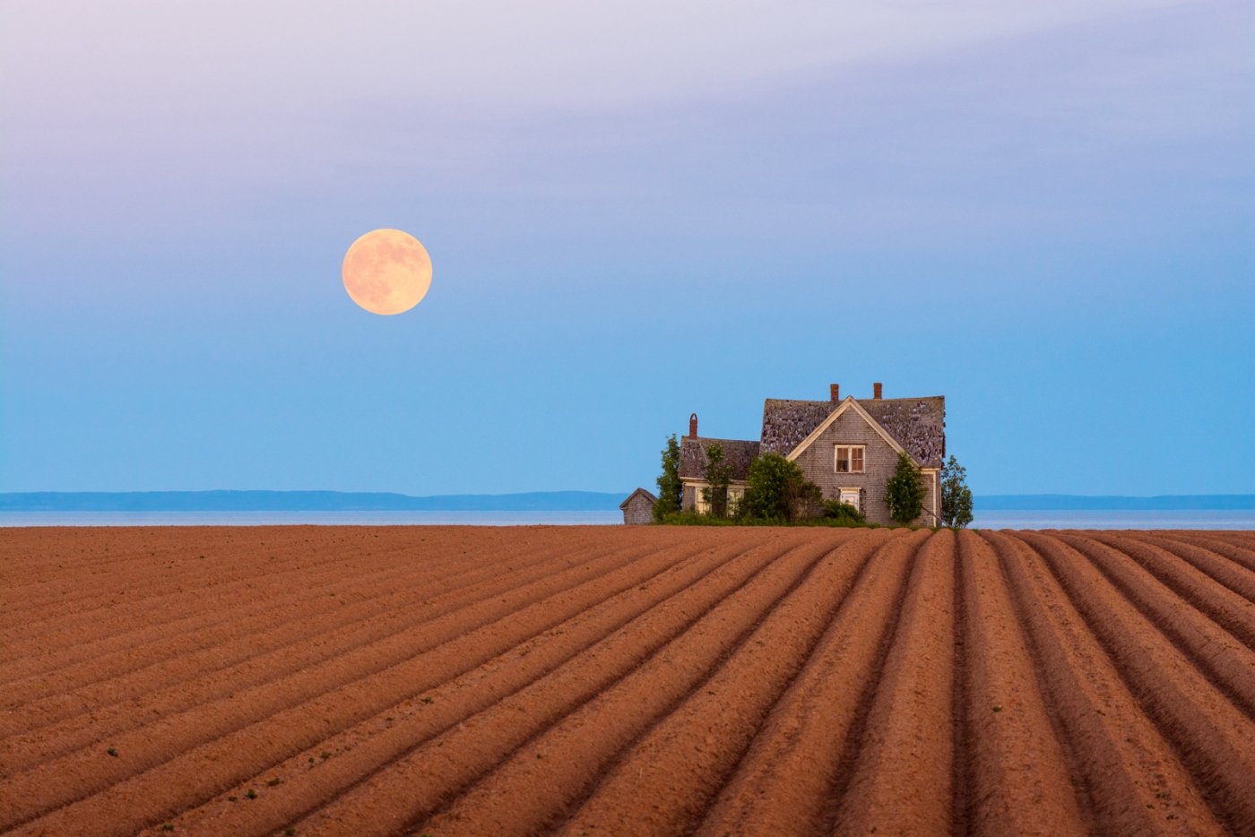 farmhouse, red soil, full moon