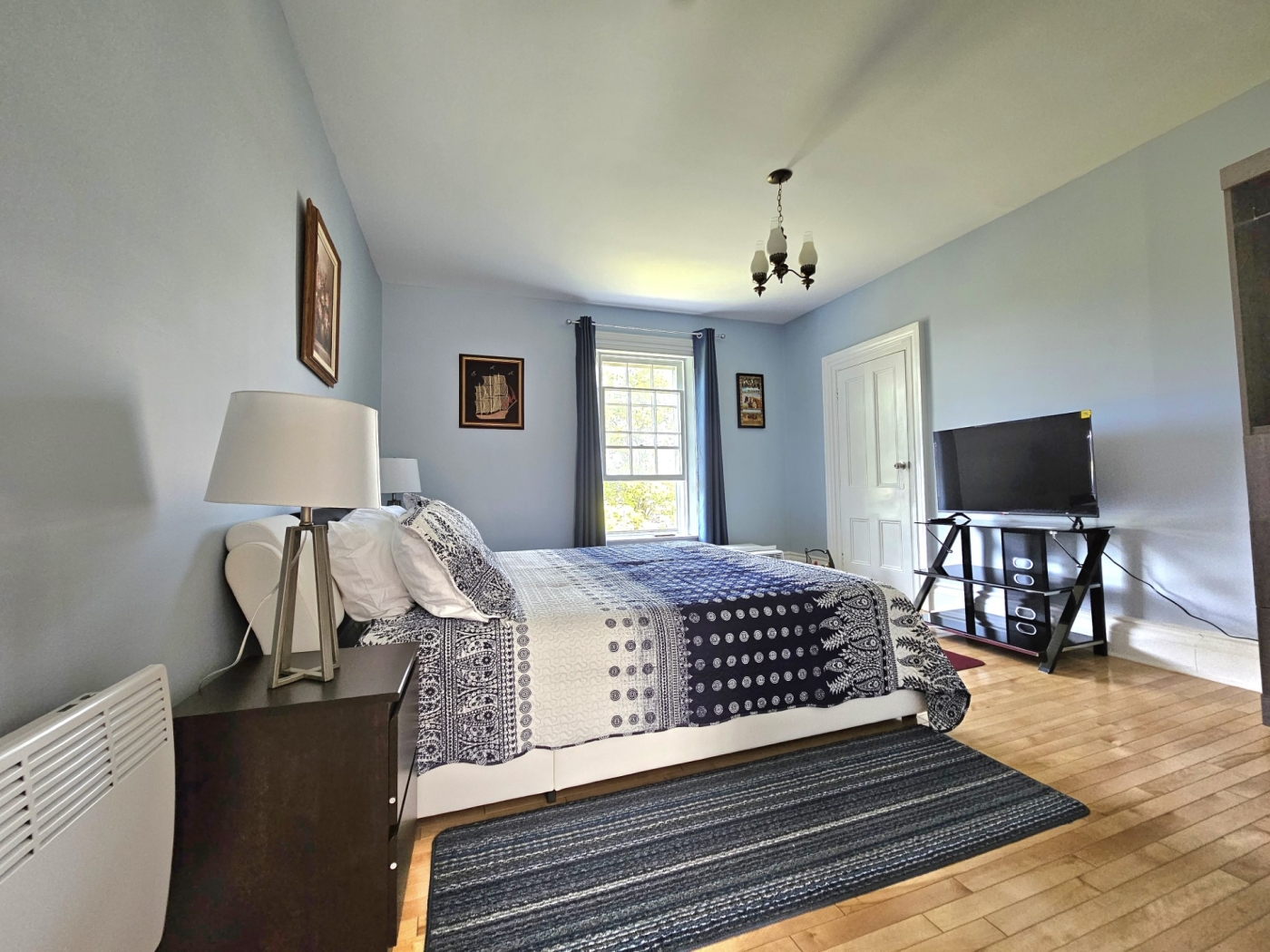 Sunflower guest suites inside photo of blue bedroom