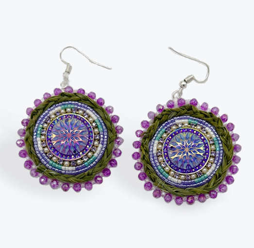 Purple and green circular sweetgrass earrings on white background