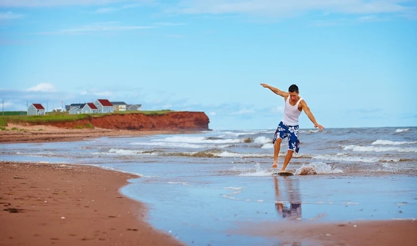 male surfer on the beach